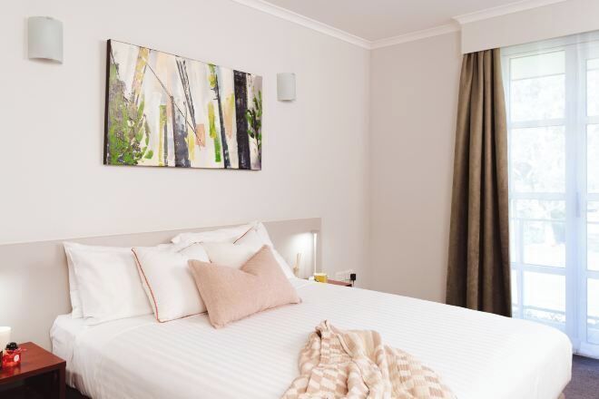 Premium bedding, blackout drapes, iron/ironing board, cribs/infant beds