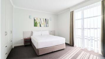 Standard Studio (Spring into Summer Package) | Premium bedding, blackout drapes, iron/ironing board, cribs/infant beds