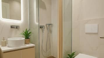 Shower, rainfall showerhead, hair dryer, towels