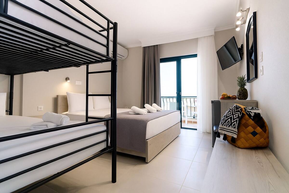 basic quadruple room, sea view | 1 bedroom, in-room safe, individually furnished, blackout curtains