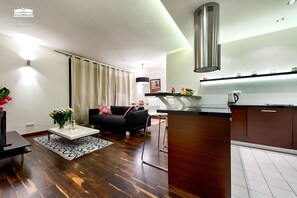 Deluxe Apartment, 1 Bedroom | Living area | Flat-screen TV