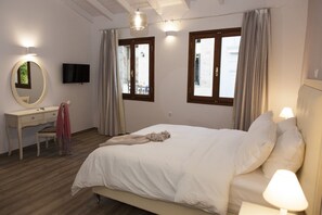Premium bedding, down duvets, in-room safe, desk