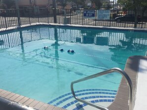 Seasonal outdoor pool, open 10:00 AM to 8:00 PM, pool umbrellas
