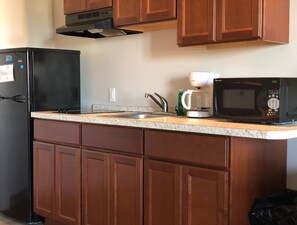 Fridge, microwave, stovetop, coffee/tea maker