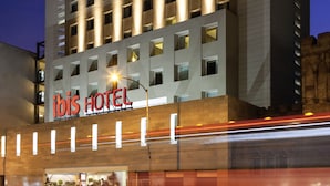 A modern hotel building with a prominent "Ibis Hotel" sign. - ibis México Alameda (Mexico City)
