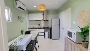 Deluxe Studio, Pool View | Private kitchen | Full-sized fridge, microwave, stovetop, coffee/tea maker