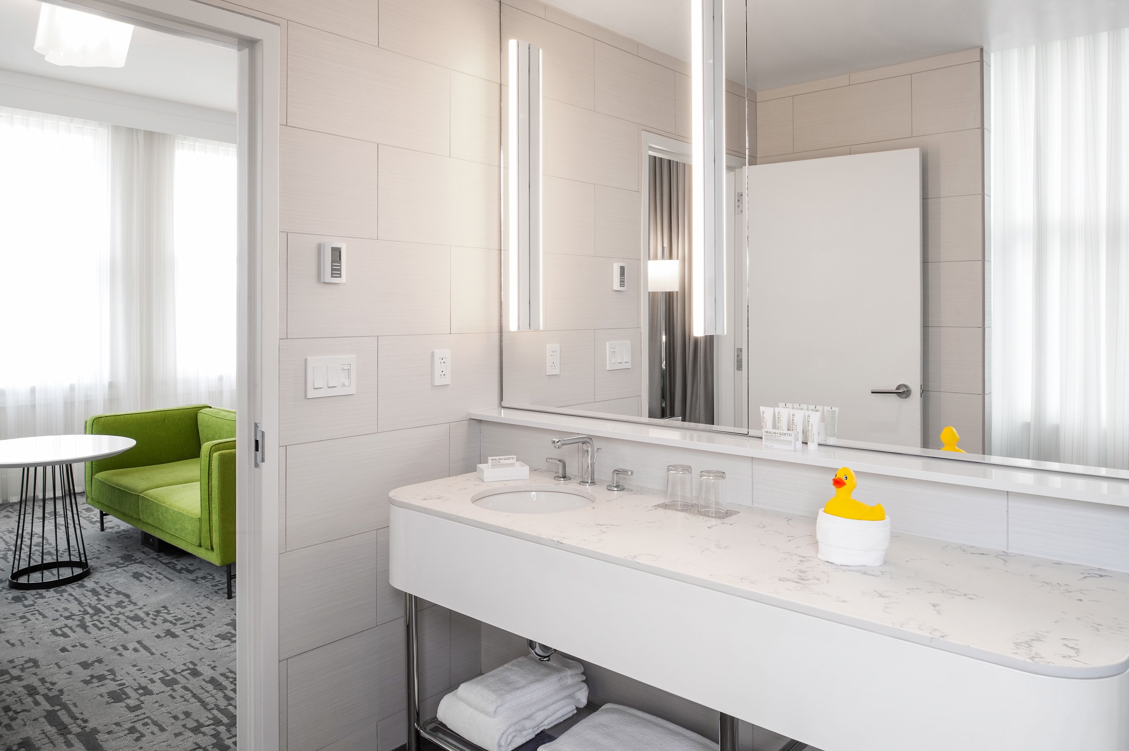 room, 1 king bed, corner | bathroom | designer toiletries, hair dryer, bathrobes, slippers