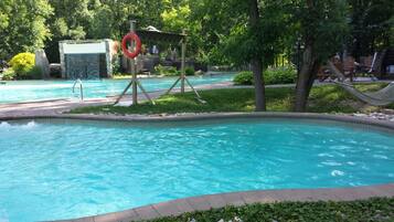 Seasonal outdoor pool, open 10:00 AM to 8:00 PM, pool loungers