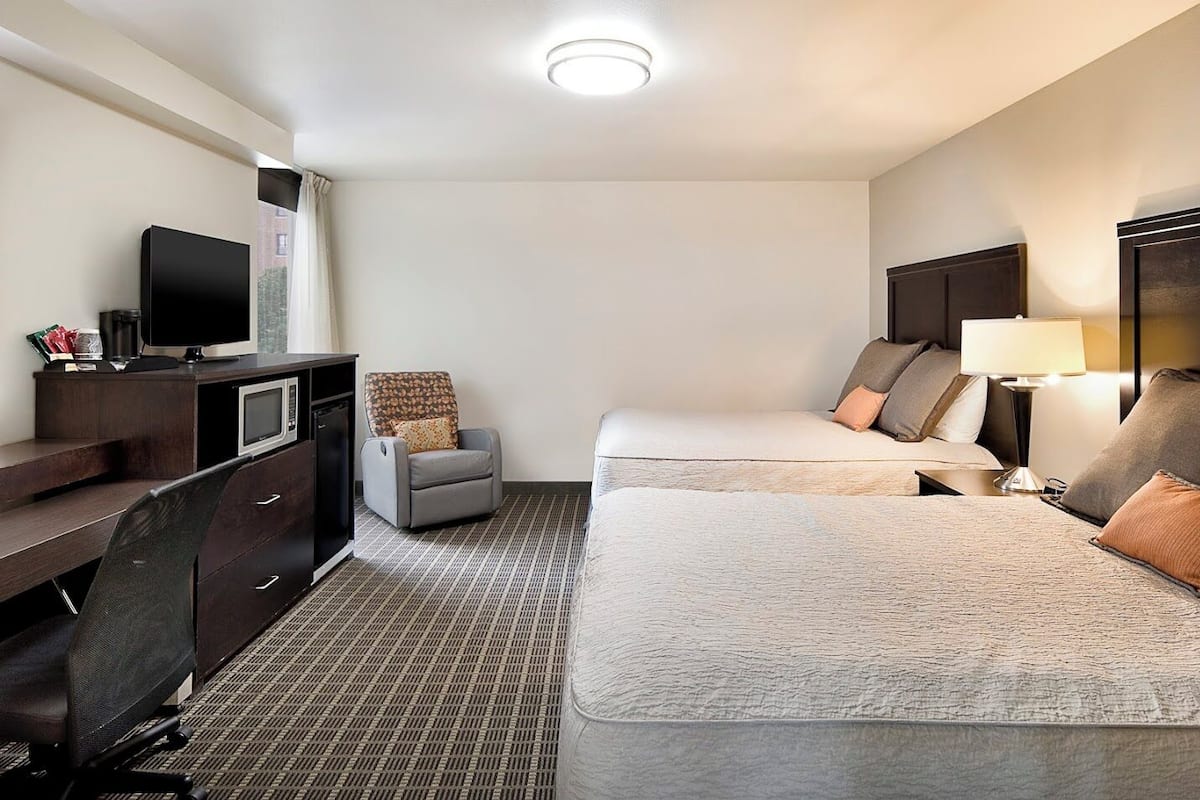 Deluxe Room, 2 Queen Beds, City View | Premium bedding, desk, iron/ironing board, free cribs/infant beds