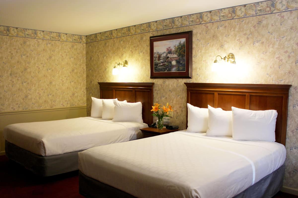 Standard Room, 2 Queen Beds, Jetted Tub | Soundproofing, iron/ironing board, rollaway beds, free WiFi