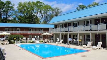 Seasonal outdoor pool, open 9:00 AM to 9:00 PM, pool umbrellas