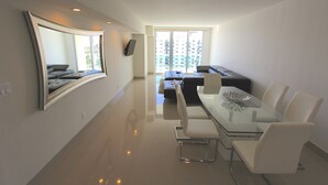 Classic Apartment, 2 Bedrooms, Bay View (OR1610) | Living area | 50-inch flat-screen TV with cable channels, TV - Ocean Reserve Apartments by FlatsAway (Sunny Isles Beach)