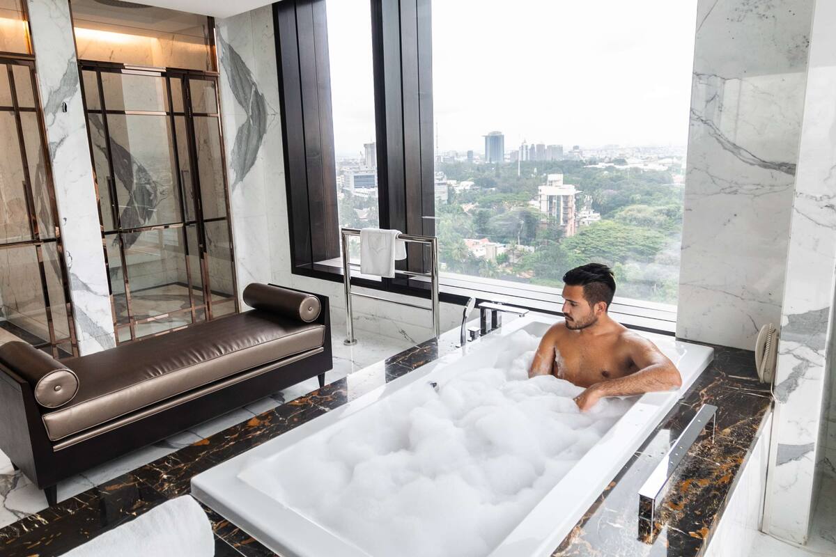 designer toiletries, hair dryer, bathrobes, slippers