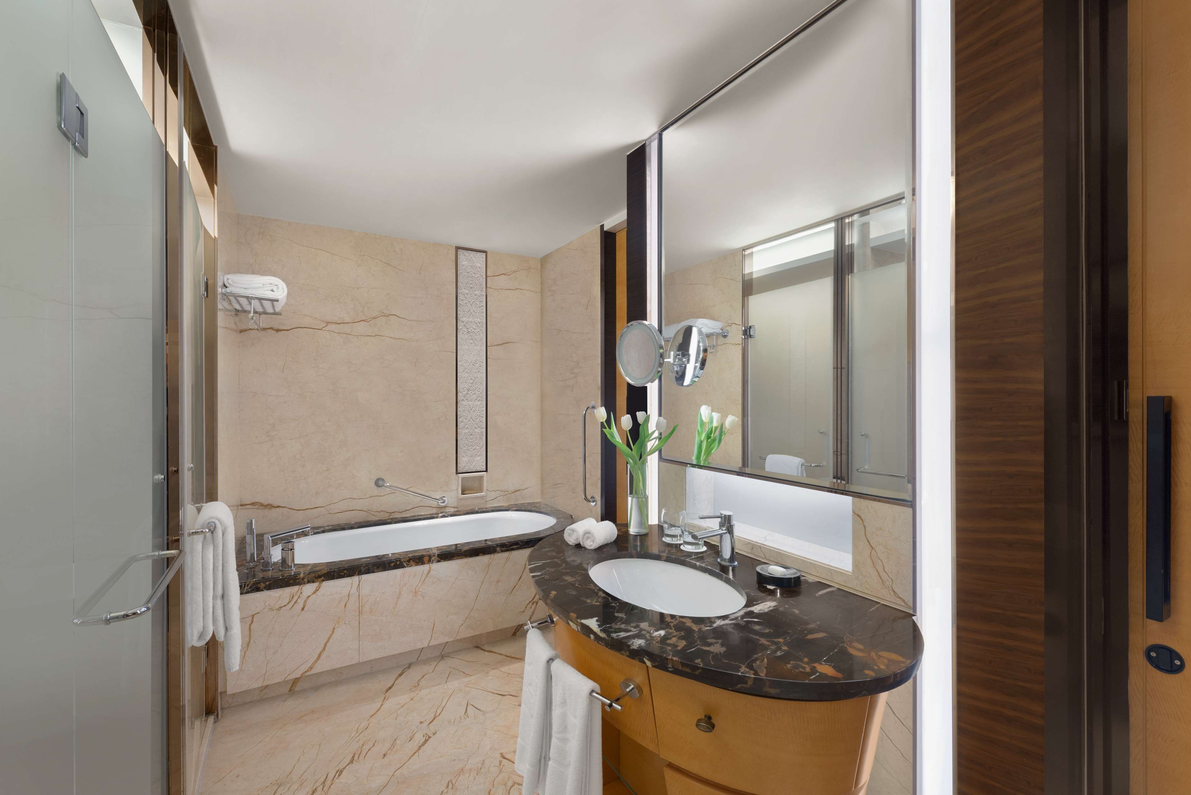 designer toiletries, hair dryer, bathrobes, slippers