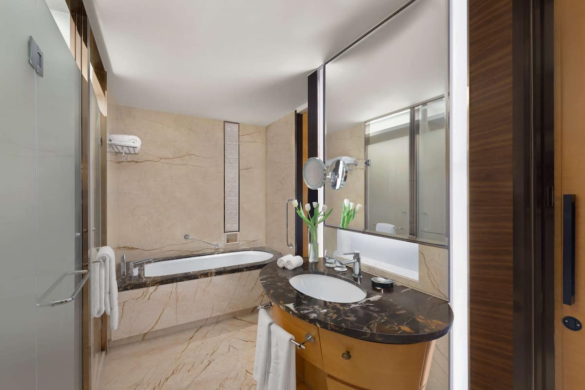 designer toiletries, hair dryer, bathrobes, slippers