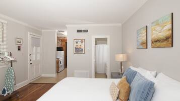 Executive Suite, 1 Bedroom, Kitchenette (Professional Suite King Bed) | Individually decorated, desk, laptop workspace, iron/ironing board