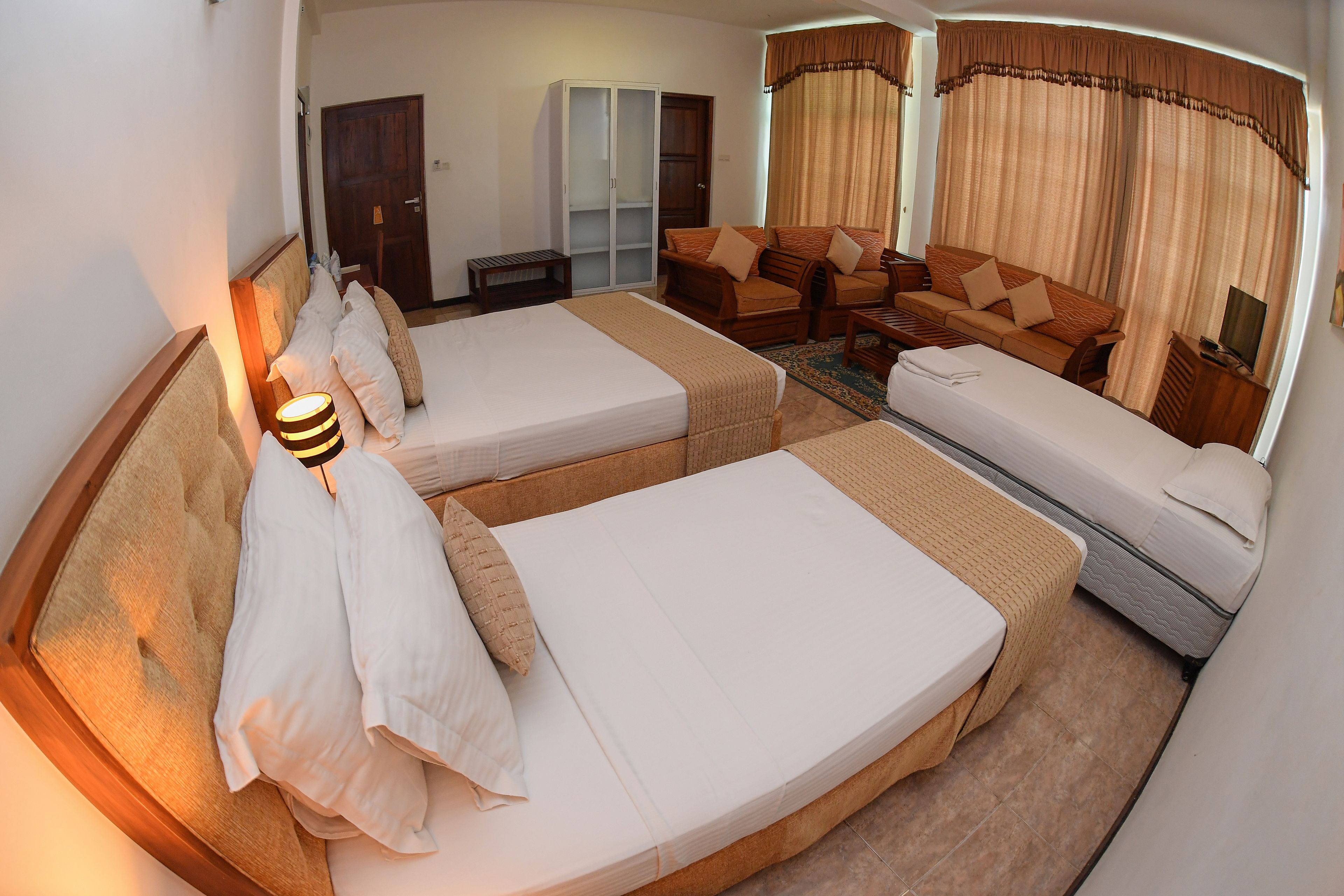 family room | minibar, in-room safe, desk, blackout curtains