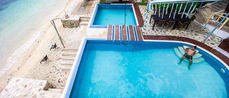 Private beach, white sand, free beach cabanas, sun loungers