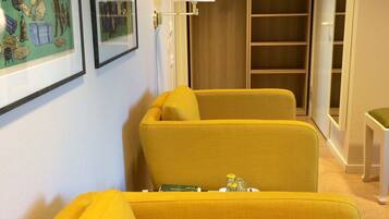 Twin Room | Living area | 50-inch flat-screen TV with digital channels, TV, streaming services