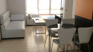 Room, 2 Bedrooms | Living room | Flat-screen TV