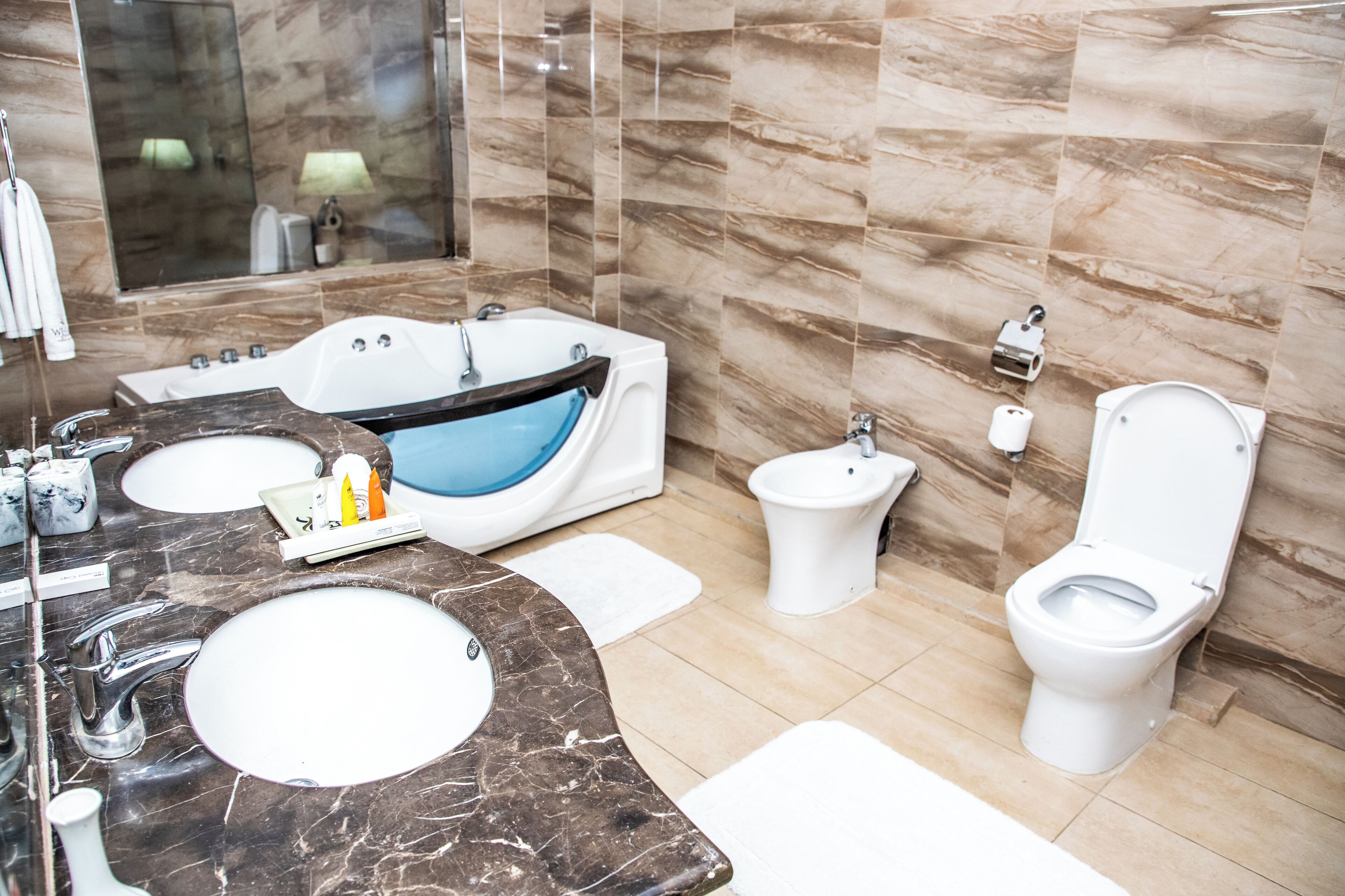 executive twin room | bathroom | free toiletries, hair dryer, bathrobes, slippers