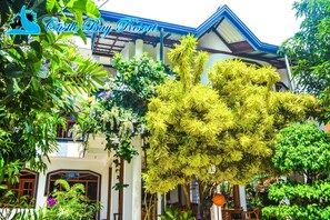 A traditional building with a sign reading "Castle Bay Resort". - Castle Bay Resort (Weligama)