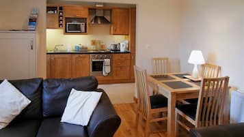 One Bed Apartment | Living area | Flat-screen TV