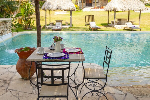 Outdoor pool, open 8:00 AM to 8:00 PM, free cabanas