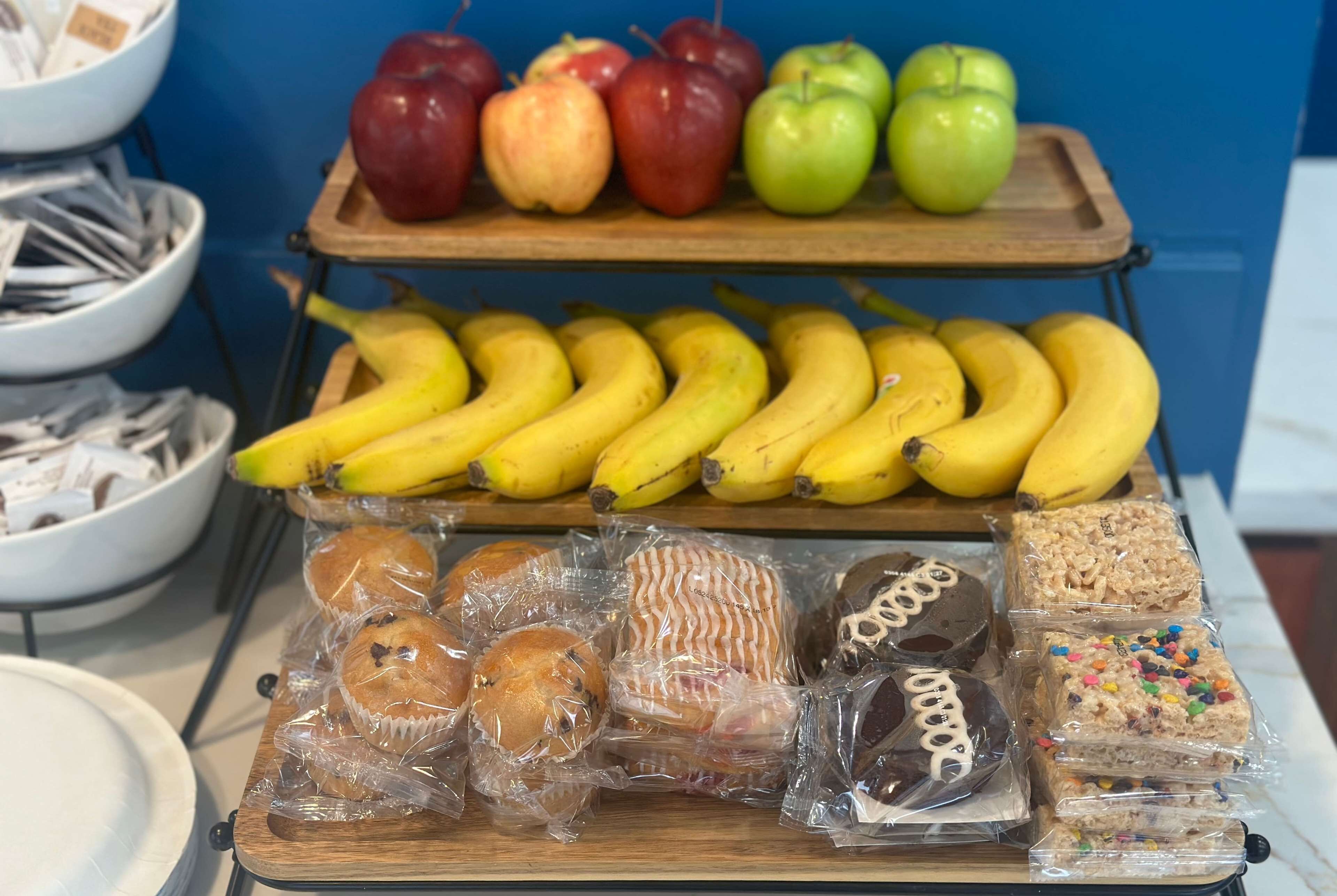 A display of fruits and baked goods.