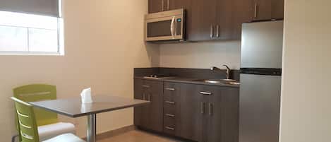 Deluxe Room, 1 Queen Bed, Kitchenette | Private kitchen | Fridge, microwave