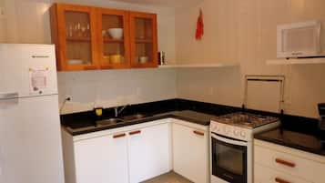 Full-sized fridge, microwave, stovetop, coffee/tea maker