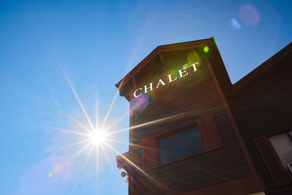 A building with the word "CHALET" on the side. - Radium Chalet (Radium Hot Springs)