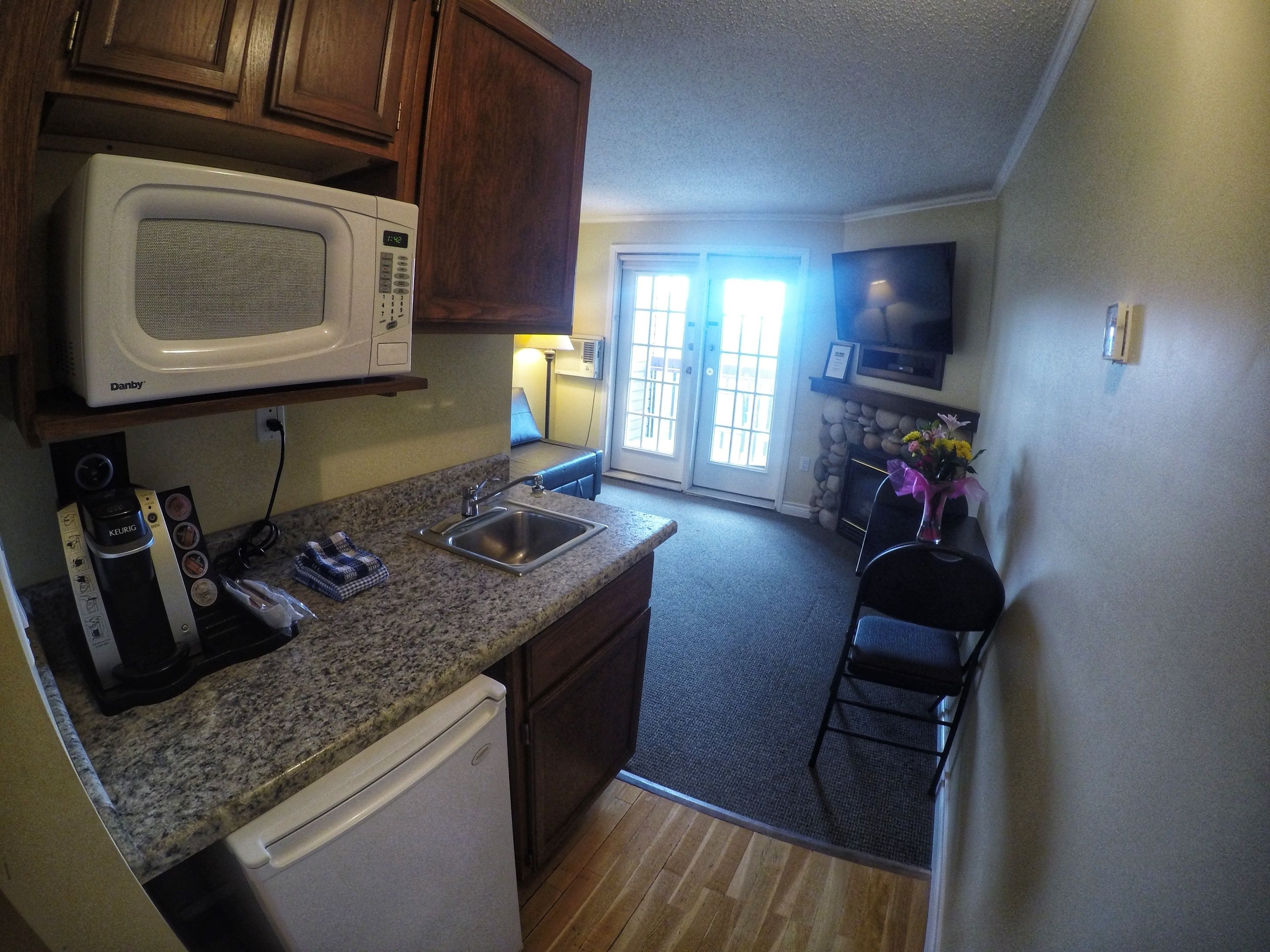 mini-fridge, microwave, electric kettle, toaster