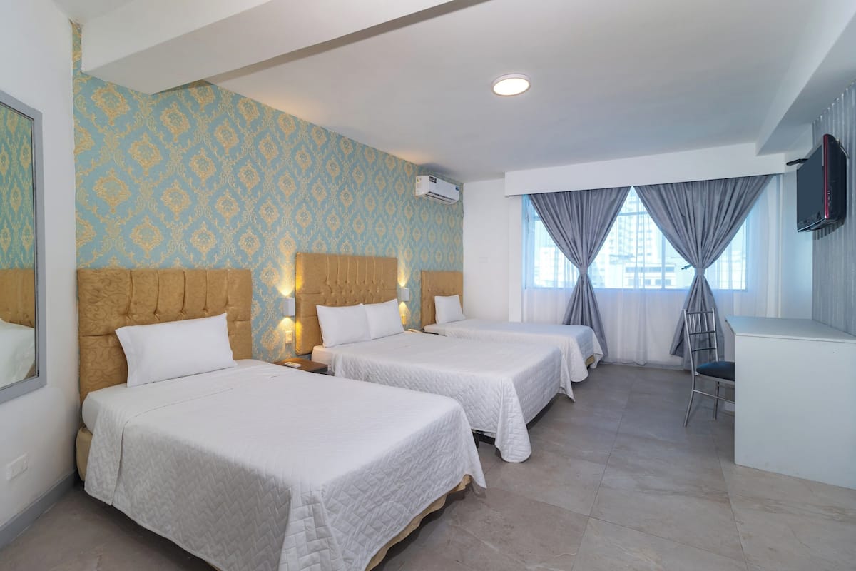 Triple Room | Down duvets, minibar, in-room safe, desk