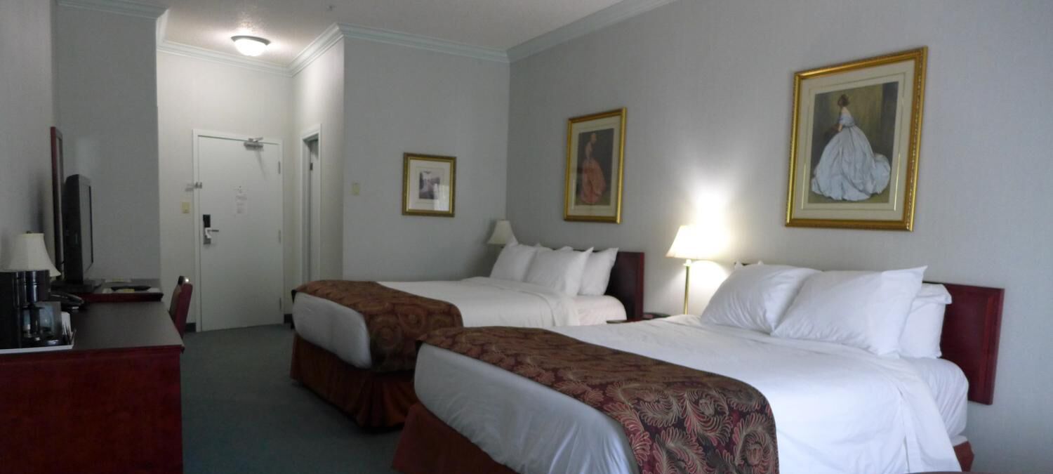 premium bedding, desk, laptop workspace, blackout curtains