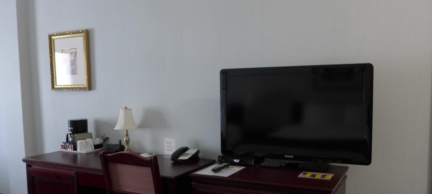 premium bedding, desk, laptop workspace, blackout curtains