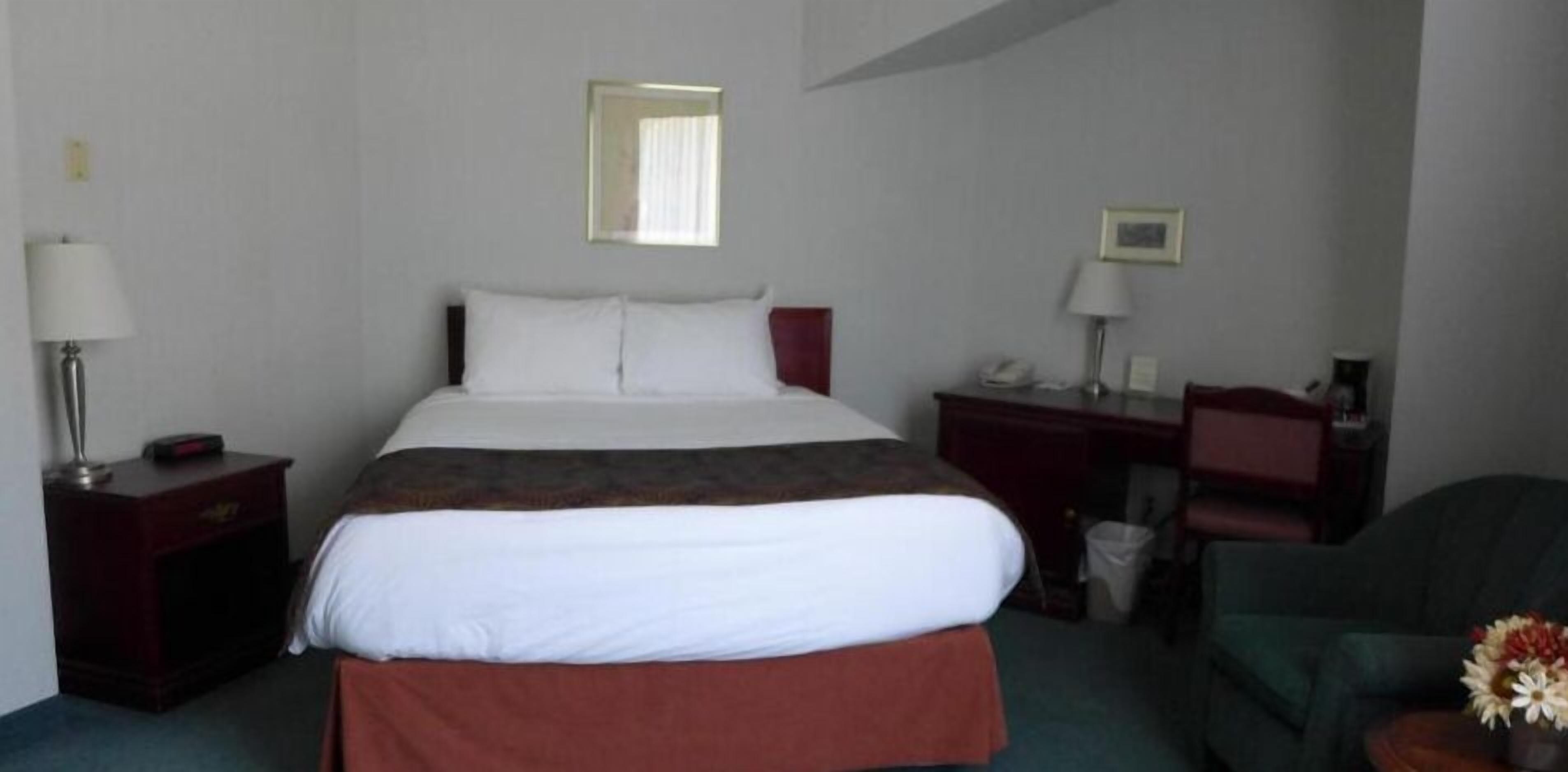 premium bedding, desk, laptop workspace, blackout curtains