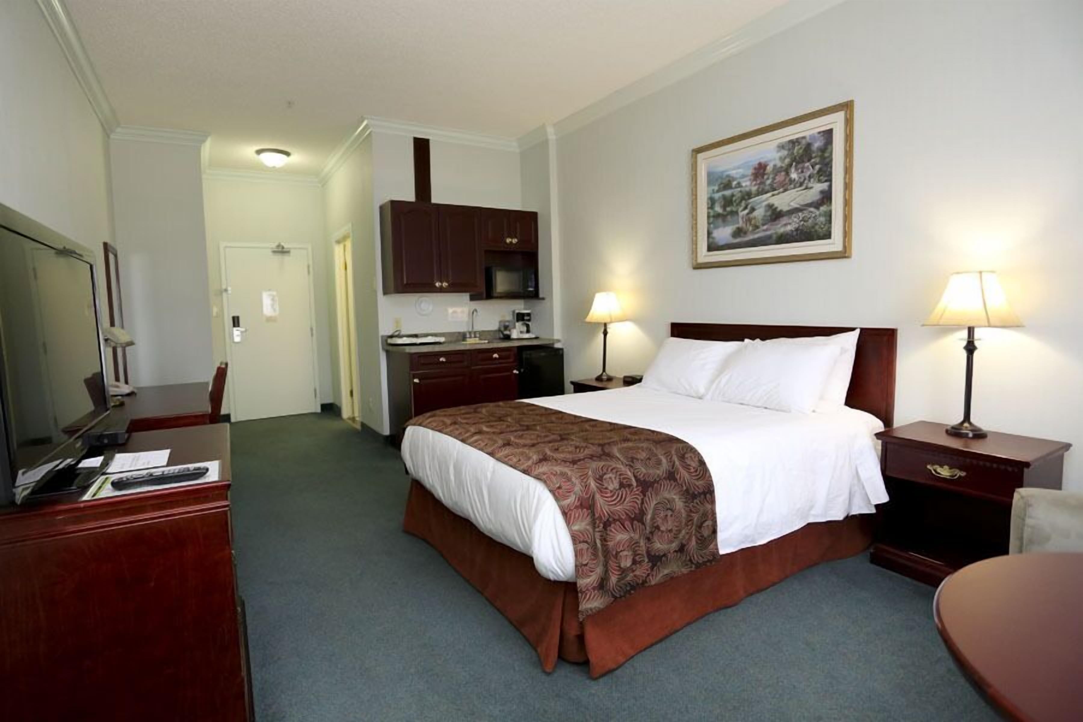 deluxe room, 1 queen bed, kitchenette | premium bedding, desk, laptop workspace, blackout curtains