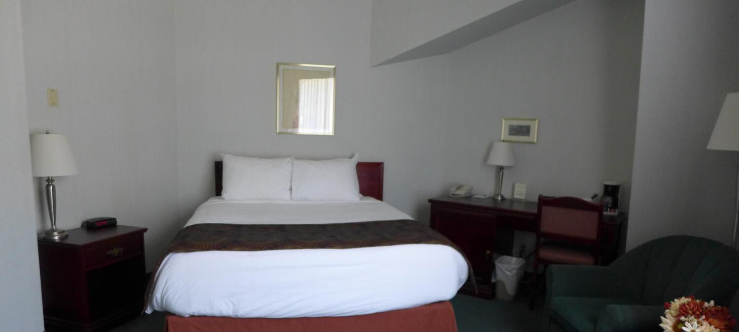 premium bedding, desk, laptop workspace, blackout curtains