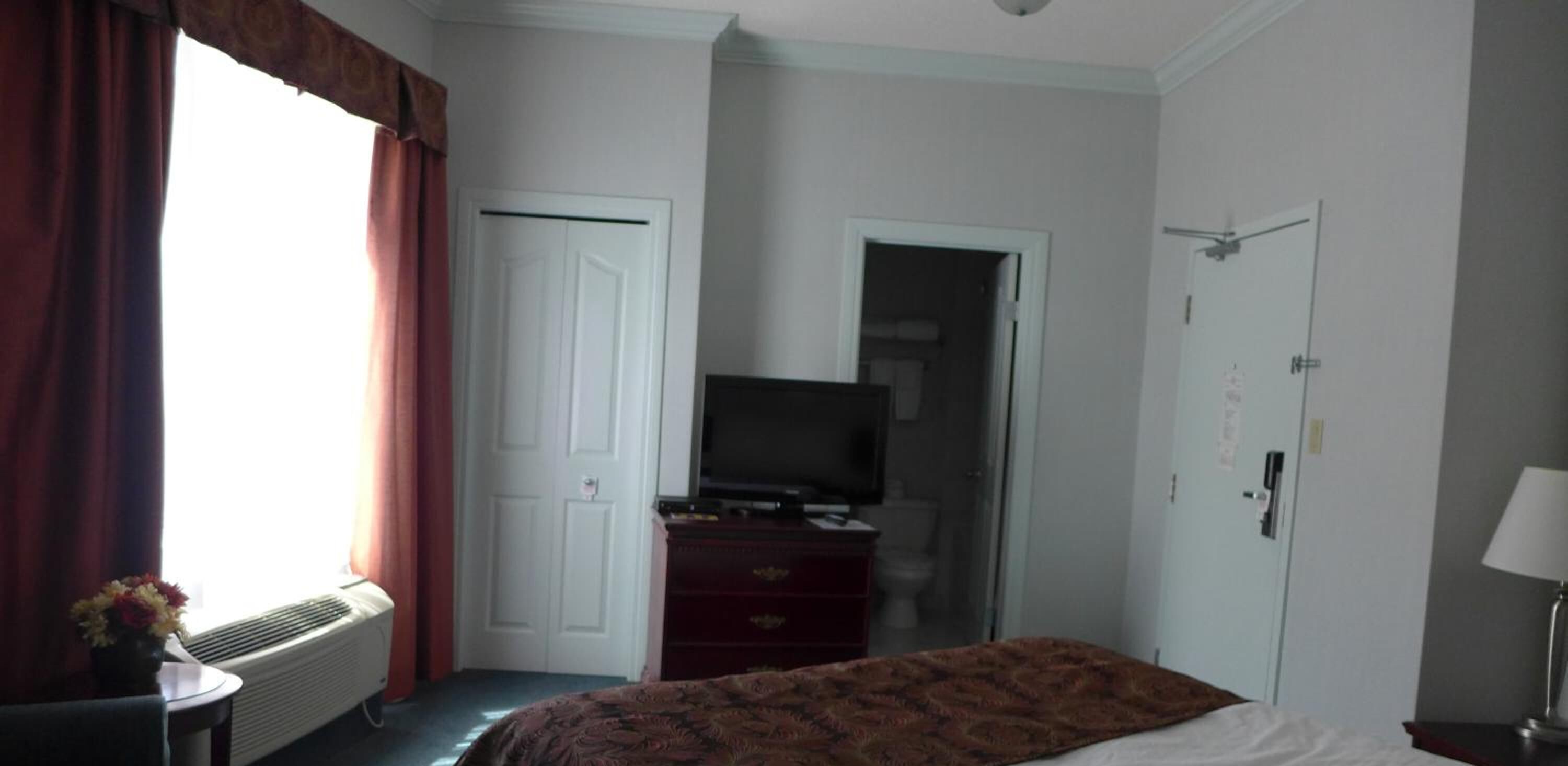 premium bedding, desk, laptop workspace, blackout curtains