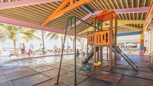 A playground with swings, slides, and a climbing structure. - diRoma Exclusive Caldas Novas (Caldas Novas)