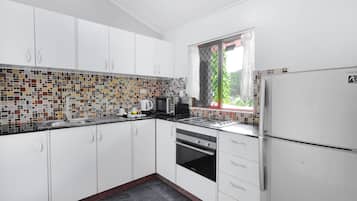 City Apartment, 2 Bedrooms | Private kitchen | Full-sized fridge, stovetop