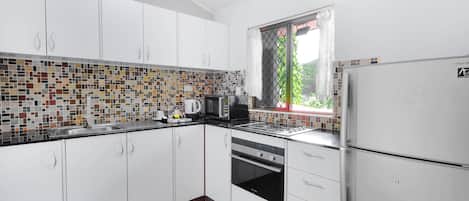 Departamento urbano, 2 habitaciones | Cocina privada | Refrigerador con congelador y parrilla de estufa