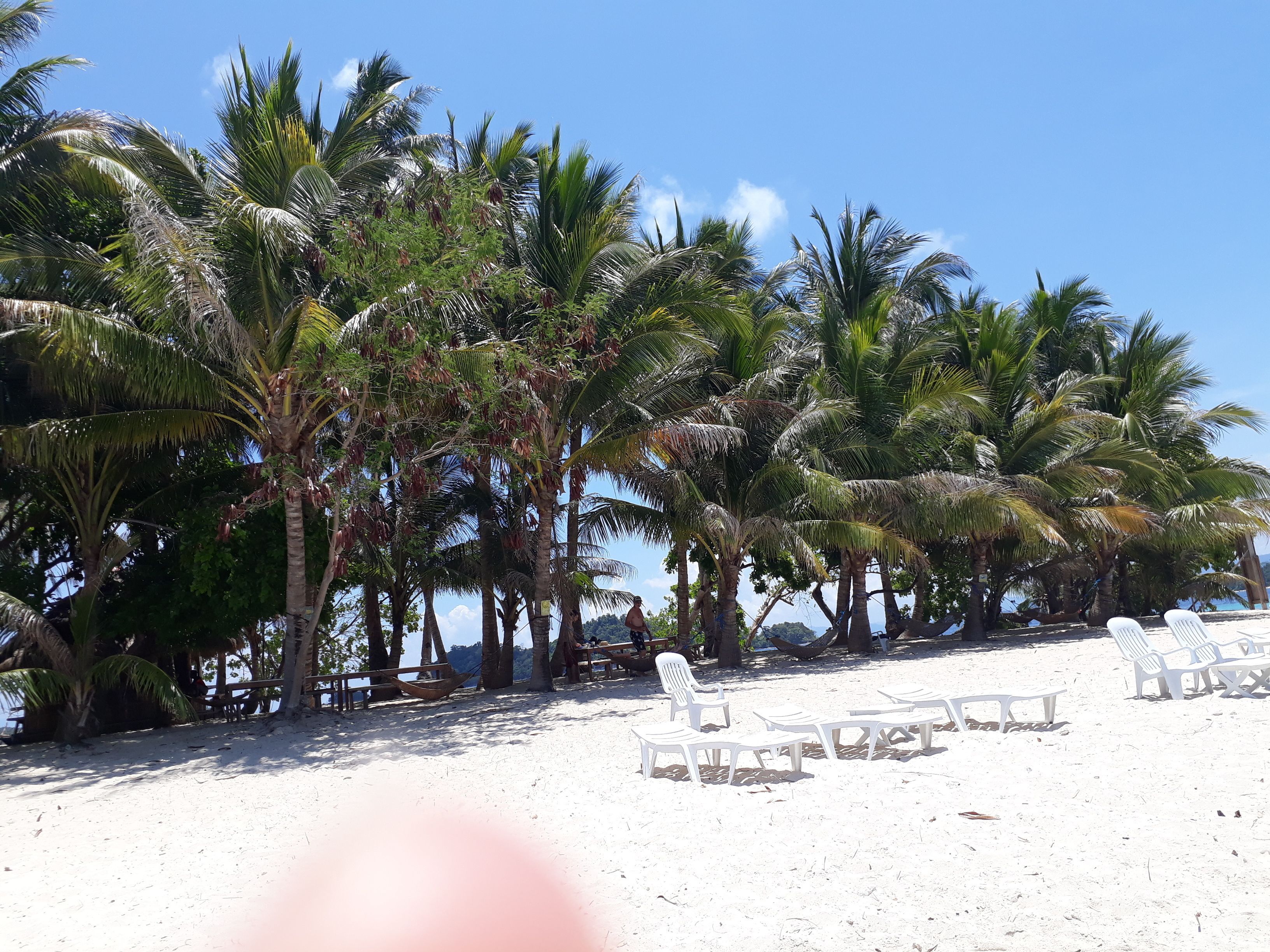 Beach nearby, white sand, beach towels