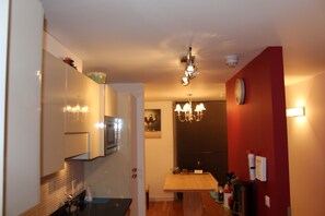 Apartment, 4 Bedrooms | Private kitchen | Full-sized fridge, microwave, stovetop, dishwasher