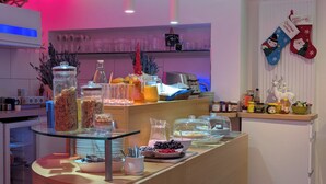 A breakfast buffet with various food items and beverages.