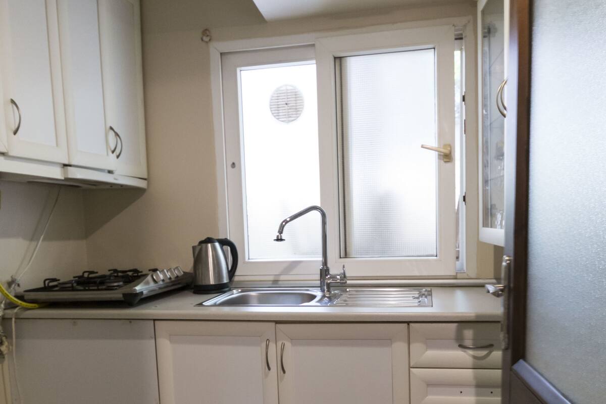 Economy Apartment, Garden Area | Private kitchen | Coffee/tea maker, fridge, stovetop, electric kettle