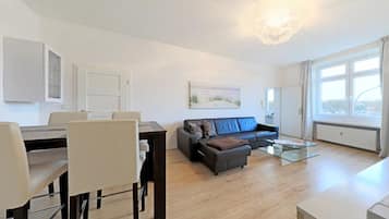 Superior Apartment, 1 Bedroom, Kitchen, River View | Living area | 119-cm LED TV with cable channels