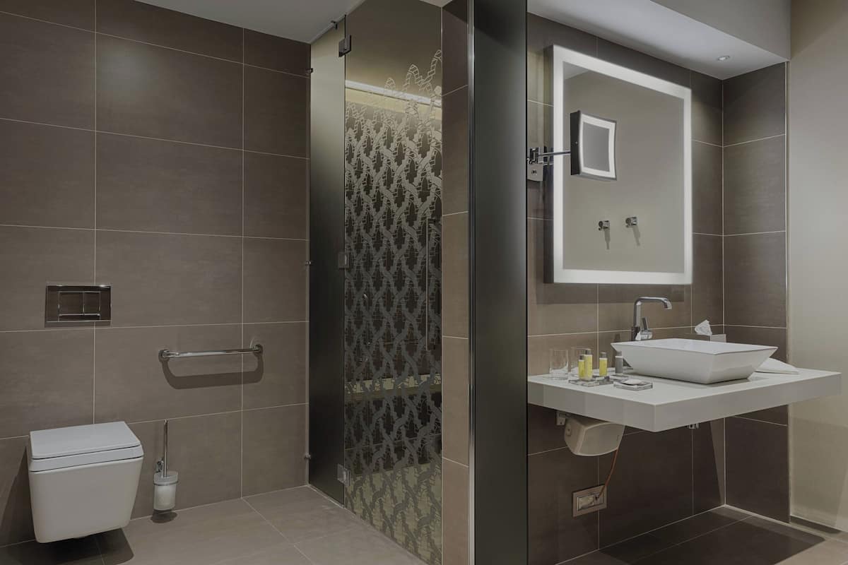 combined shower/bathtub, designer toiletries, hair dryer, bathrobes