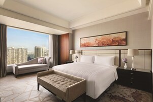 Premium bedding, down comforters, minibar, in-room safe